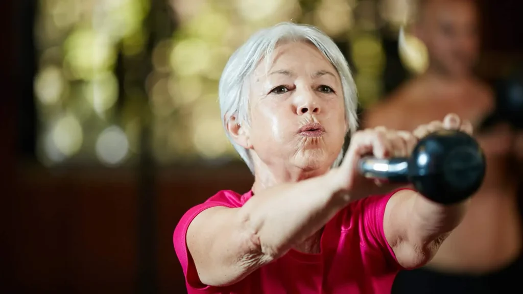 Toning Bingo Wings: Effective Exercises and Tips for Achieving Sleeker Arms 2 Person performing arm exercises with dumbbells Blackheath