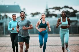 Sculpting Sleek Arms: The Essential Role of Cardio in Toning Without Bulking Up 3 image of people running to incorporate cardio Blackheath exercise into their life to help tone arms and body.