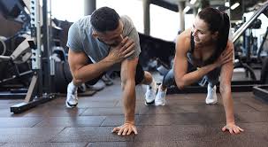 Sculpting Sleek Arms: The Essential Role of Cardio in Toning Without Bulking Up 1 Image of man and woman doing Cardio Blackheath to tone their arms.